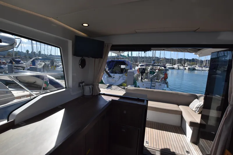 Indian Summer Yacht Photos Pics Interior view of 2016 Sealine C330 yacht with marina backdrop.