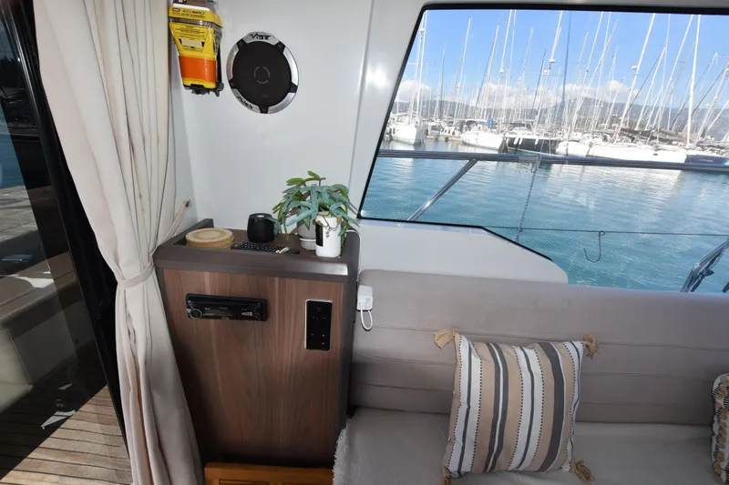 Indian Summer Yacht Photos Pics Interior of 2016 Sealine C330 yacht with marina view through window.
