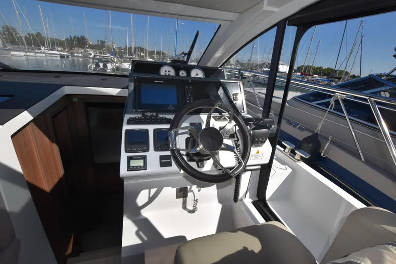 Indian Summer Yacht Photos Pics Helm of 2016 Sealine C330. full electronic package with comfortable helm seat