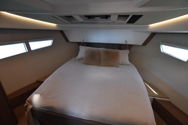 Indian Summer Yacht Photos Pics Luxurious cabin interior of 2016 Sealine C330 yacht with cozy bed and ambient lighting.