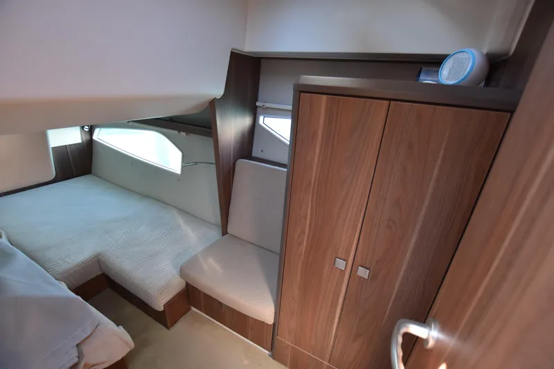Indian Summer Yacht Photos Pics Interior cabin of 2016 Sealine C330 yacht with bed and wooden wardrobe.