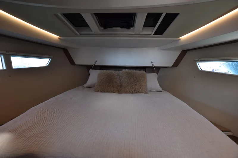 Indian Summer Yacht Photos Pics Interior cabin of 2016 Sealine C330 yacht with cozy bed and ambient lighting.