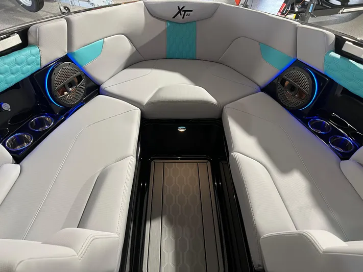  Yacht Photos Pics 2025 MasterCraft XT23 boat interior with modern seating and blue accents.