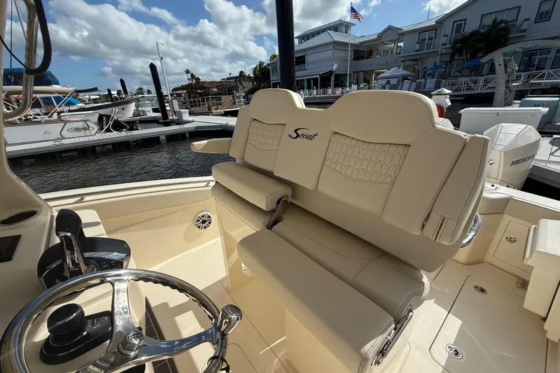  Yacht Photos Pics 2026 Scout 288 LXF boat interior with luxurious seating at marina.