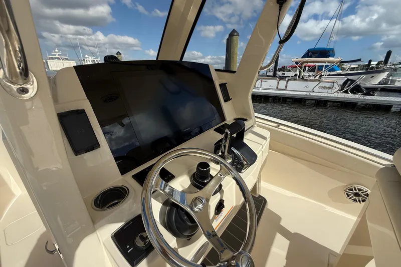  Yacht Photos Pics 2026 Scout 288 LXF boat helm with modern controls and navigation display.