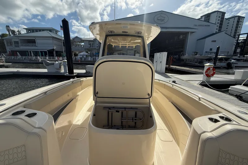  Yacht Photos Pics 2026 Scout 288 LXF boat docked at marina with open storage compartment.