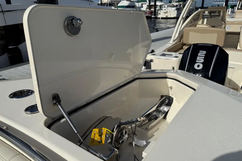  Yacht Photos Pics 2026 Scout 288 LXF boat with open storage compartment and Mercury 250 engine.