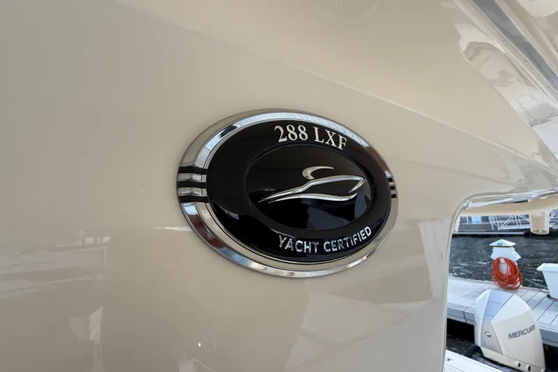  Yacht Photos Pics 2026 Scout 288 LXF yacht certified emblem on boat exterior.