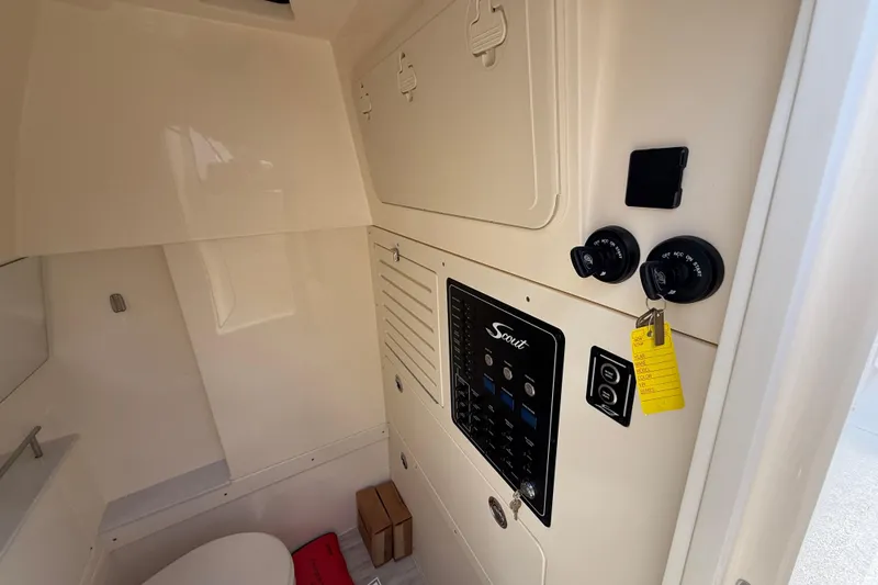  Yacht Photos Pics 2026 Scout 288 LXF boat interior with control panel and storage compartments.