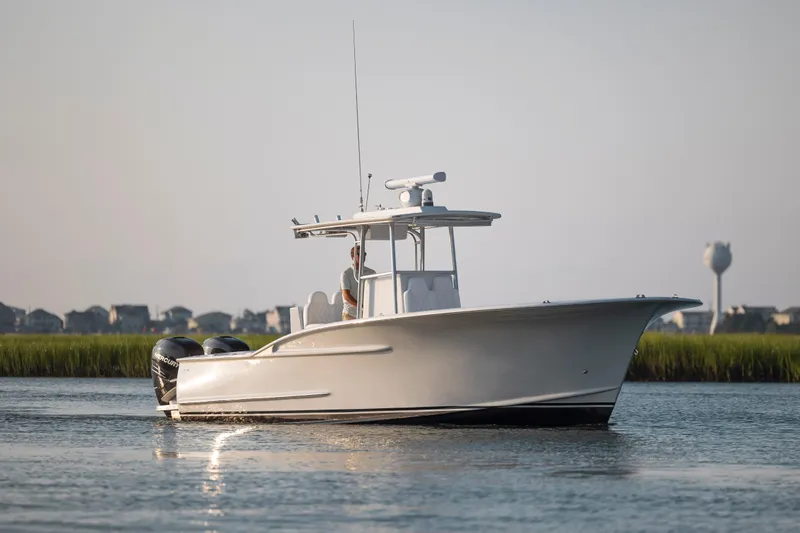  Yacht Photos Pics 2019 Willis 33 Center Console boat cruising on calm water.