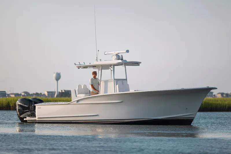  Yacht Photos Pics 2019 Willis 33 Center Console boat on calm water.