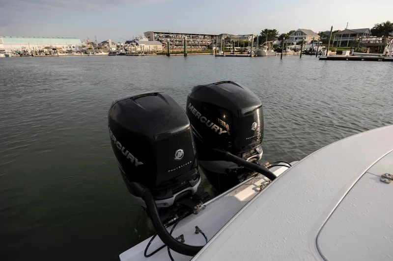  Yacht Photos Pics 2019 Willis 33 Center Console with twin Mercury outboard engines docked at a marina.