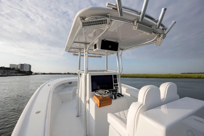  Yacht Photos Pics 2019 Willis 33 Center Console boat on calm water with modern navigation equipment.