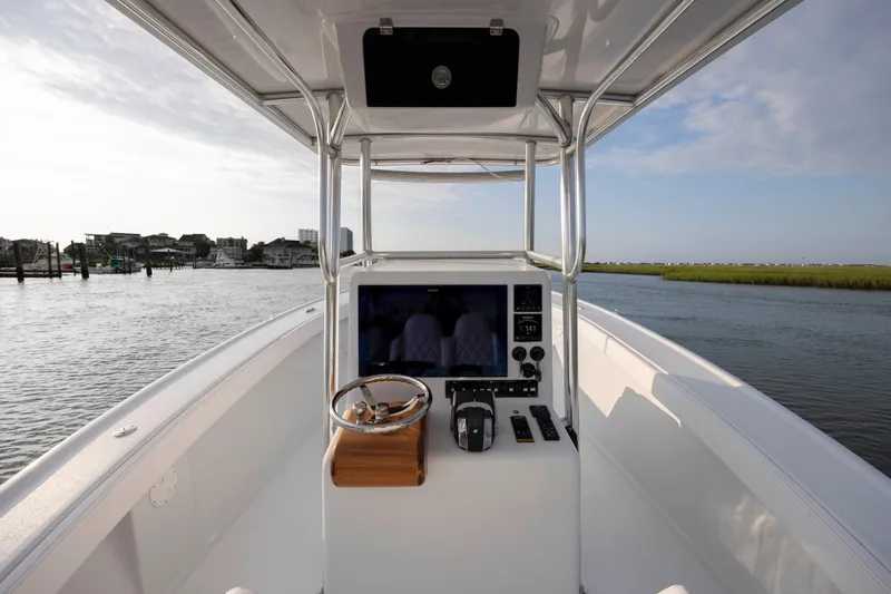  Yacht Photos Pics 2019 Willis 33 Center Console boat on calm water with scenic background.
