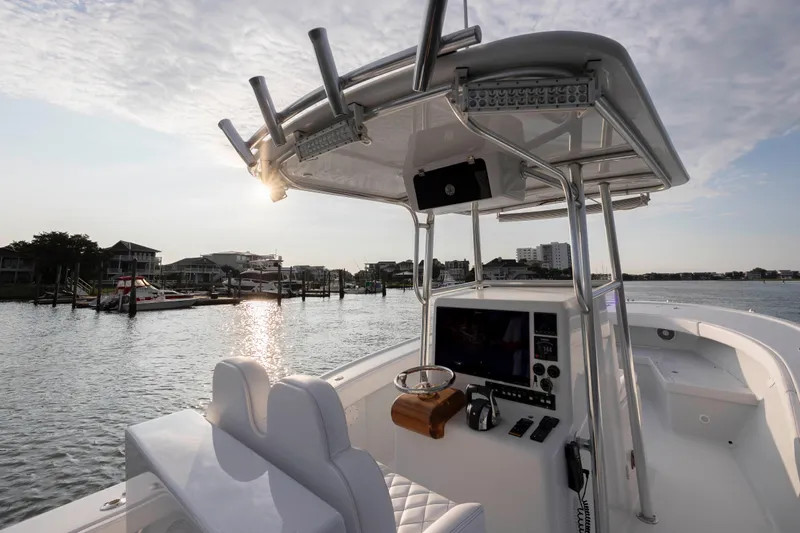  Yacht Photos Pics 2019 Willis 33 Center Console boat on a calm waterfront at sunset.