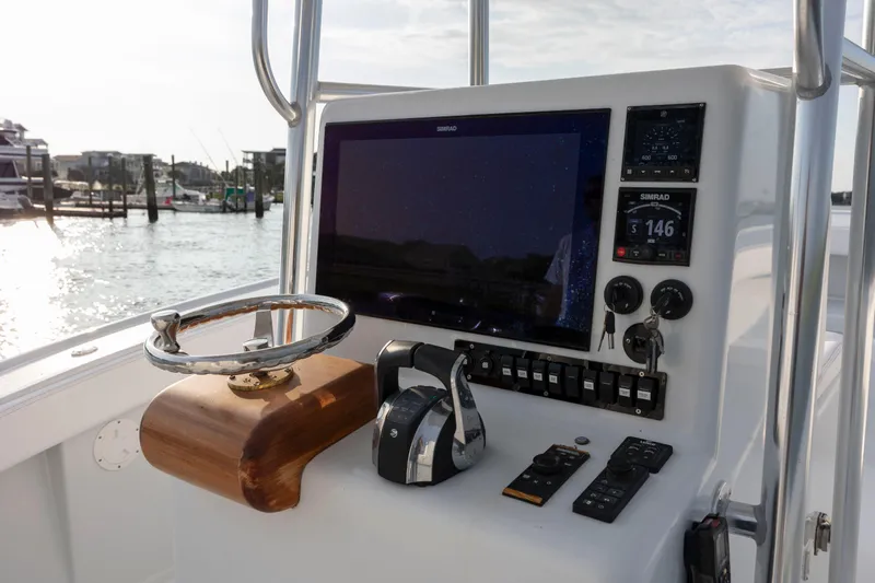  Yacht Photos Pics 2019 Willis 33 Center Console boat helm with modern navigation equipment.
