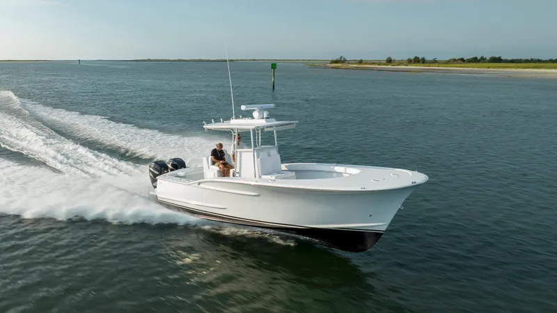  Yacht Photos Pics 2019 Willis 33 Center Console boat cruising on open water.