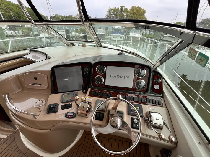 At Last Yacht Photos Pics Helm of 2004 Sea Ray 420 Sundancer with Garmin navigation system and controls.