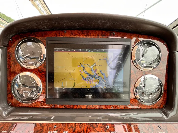 At Last Yacht Photos Pics Dashboard of 2004 Sea Ray 420 Sundancer with navigation display and gauges.