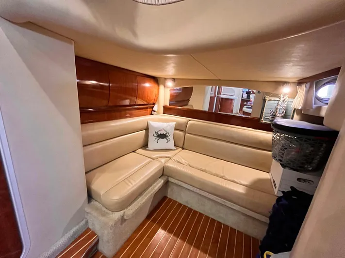 At Last Yacht Photos Pics Luxurious interior of 2004 Sea Ray 420 Sundancer with beige leather seating and wood accents.