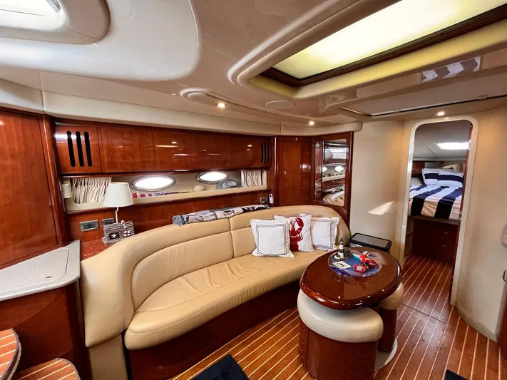 At Last Yacht Photos Pics Luxurious interior of 2004 Sea Ray 420 Sundancer yacht with elegant wood finishes.