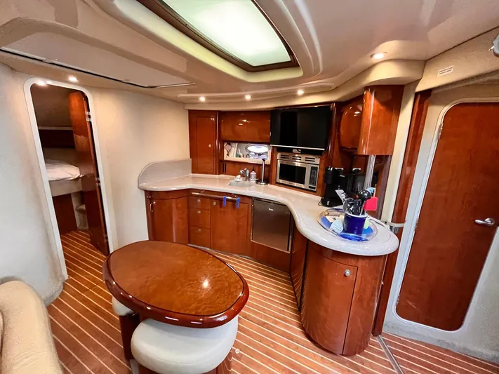 At Last Yacht Photos Pics Luxurious interior of a 2004 Sea Ray 420 Sundancer yacht with modern amenities.
