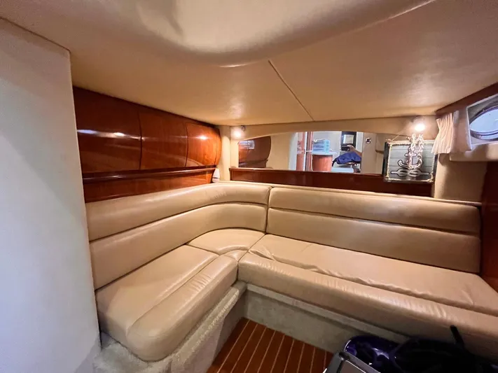 At Last Yacht Photos Pics Luxurious interior of 2004 Sea Ray 420 Sundancer with beige leather seating.