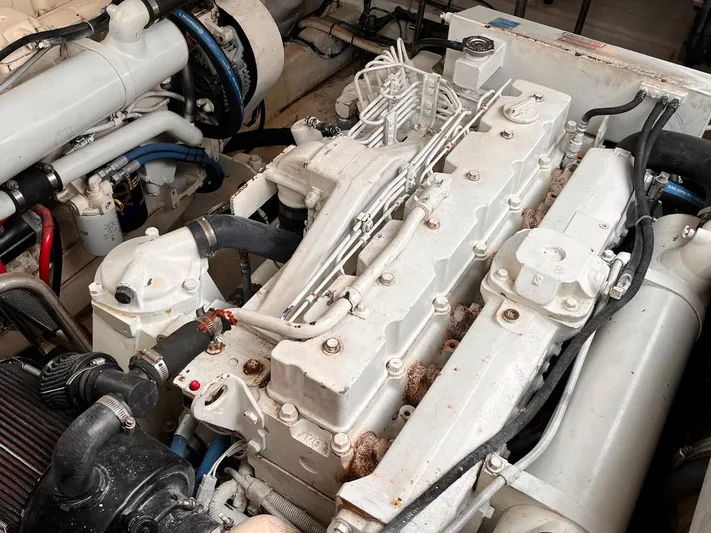 At Last Yacht Photos Pics Engine compartment of a 2004 Sea Ray 420 Sundancer, showcasing detailed mechanical components.