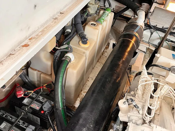 At Last Yacht Photos Pics Engine compartment of a 2004 Sea Ray 420 Sundancer, showing batteries and fuel tank.