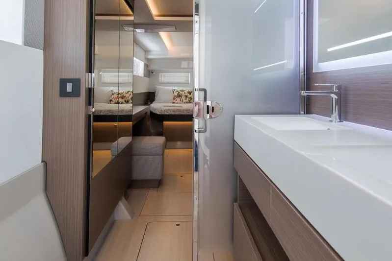  Yacht Photos Pics Modern interior of 2023 Leopard 46 Powercat yacht with sleek bathroom and cozy bedroom.