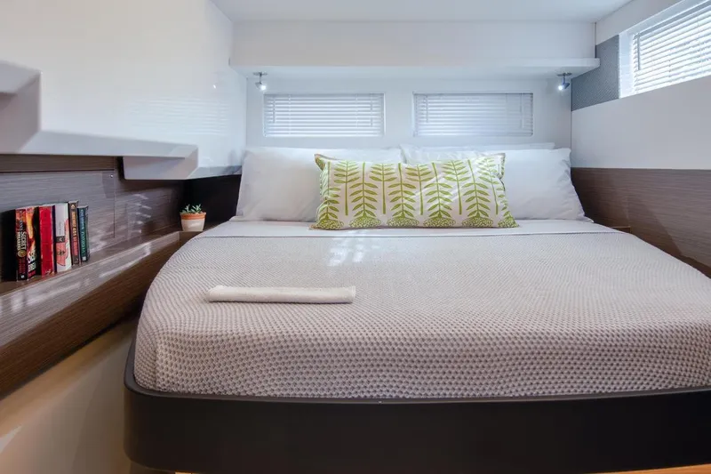  Yacht Photos Pics Luxurious bedroom interior of 2023 Leopard 46 Powercat yacht with modern decor and cozy bedding.