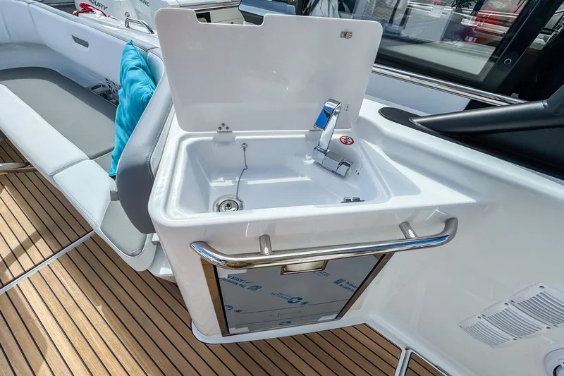  Yacht Photos Pics 2026 Wellcraft 38 T-Top boat with sleek sink and modern deck design.