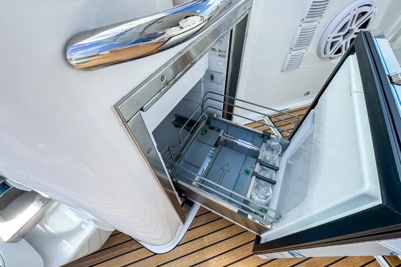  Yacht Photos Pics Open refrigerator on 2026 Wellcraft 38 T-Top boat, showcasing modern design and functionality.