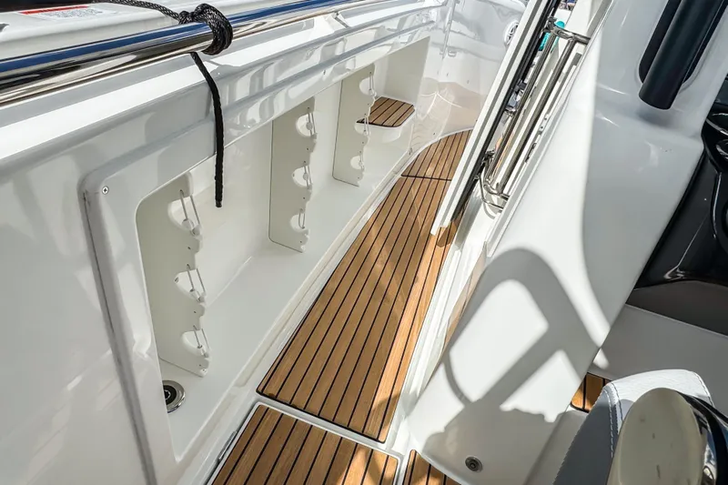  Yacht Photos Pics 2026 Wellcraft 38 T-Top boat interior with sleek wood flooring and storage compartments.