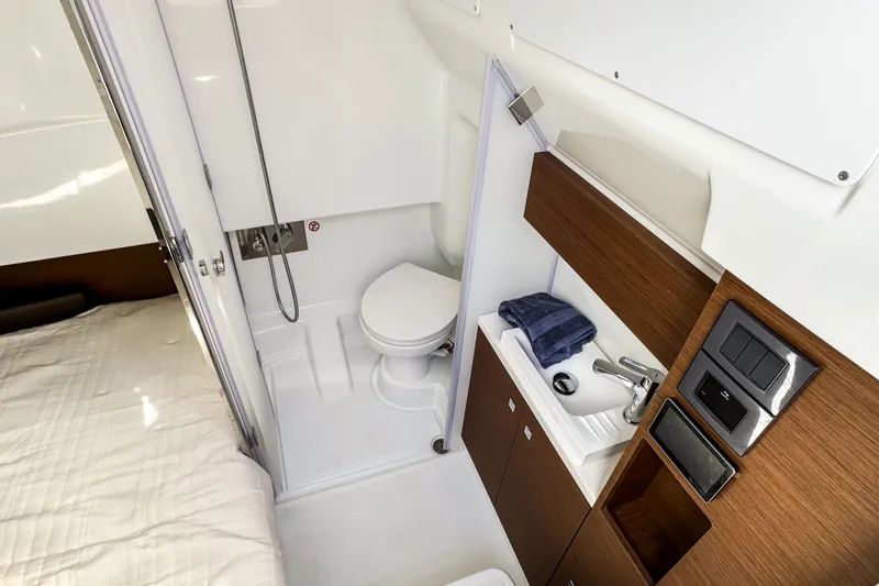  Yacht Photos Pics Modern bathroom in 2026 Wellcraft 38 T-Top boat, featuring sleek design and compact amenities.