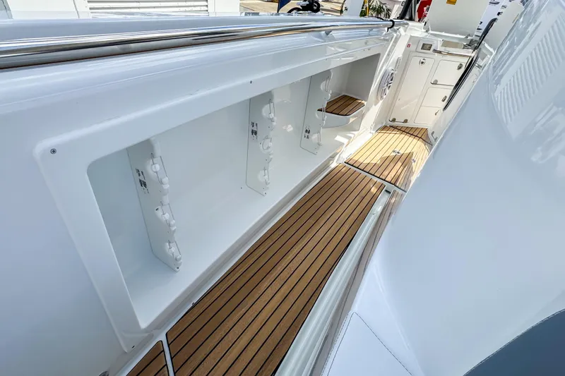  Yacht Photos Pics 2026 Wellcraft 38 T-Top boat interior with sleek design and wooden flooring.