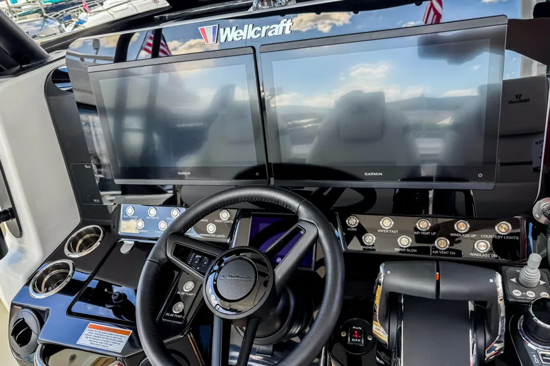  Yacht Photos Pics 2026 Wellcraft 38 T-Top helm with dual Garmin displays and modern controls.