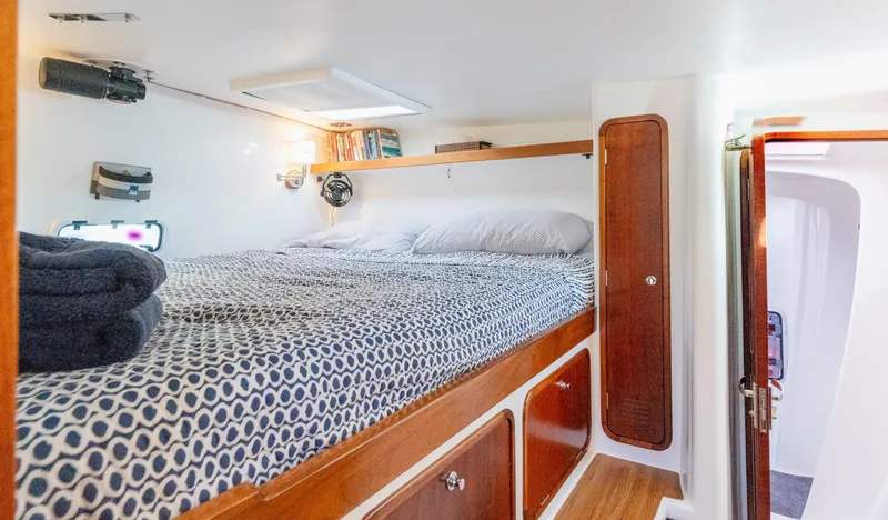 Nogal Yacht Photos Pics Cozy cabin interior of 2009 Chris White Atlantic 57 yacht with patterned bedding.