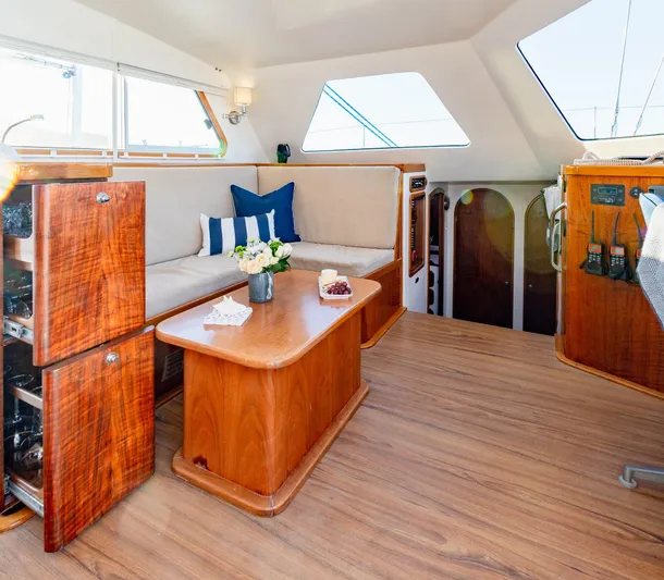 Nogal Yacht Photos Pics Luxurious interior of 2009 Chris White Atlantic 57 catamaran with elegant wood finish.