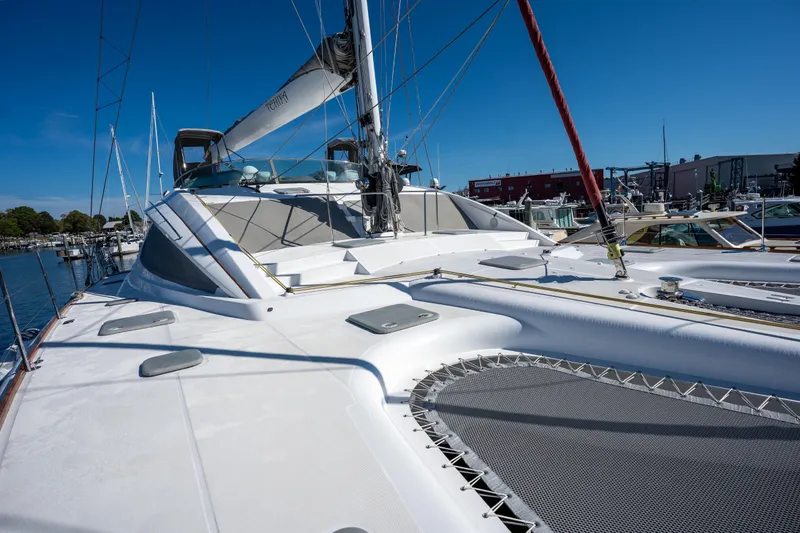 Tehiya Yacht Photos Pics Luxury Privilege 615 catamaran docked, showcasing sleek design and spacious deck, 2009 model.