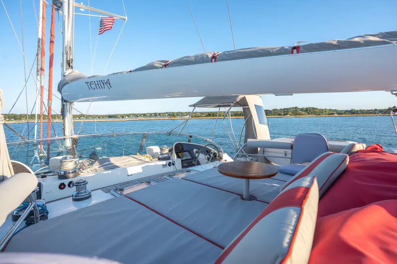 Tehiya Yacht Photos Pics Luxurious 2009 Privilege 615 yacht deck with seating, table, and scenic ocean view.