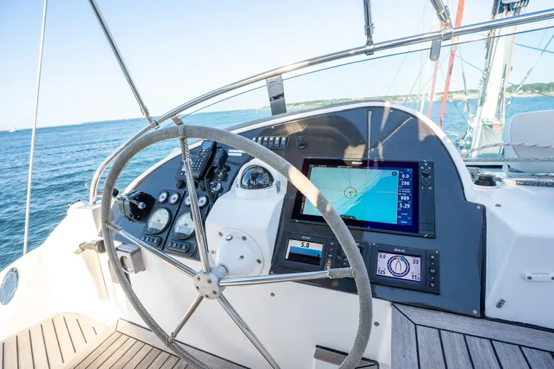 Tehiya Yacht Photos Pics Steering wheel and navigation system on 2009 Privilege 615 yacht, ocean view.