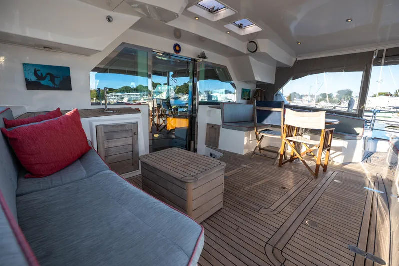 Tehiya Yacht Photos Pics Spacious deck of 2009 Privilege 615 yacht with seating and wooden flooring.