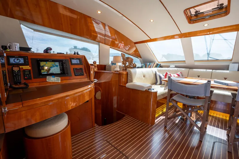 Tehiya Yacht Photos Pics Luxurious 2009 Privilege 615 yacht interior with navigation station and cozy seating area.