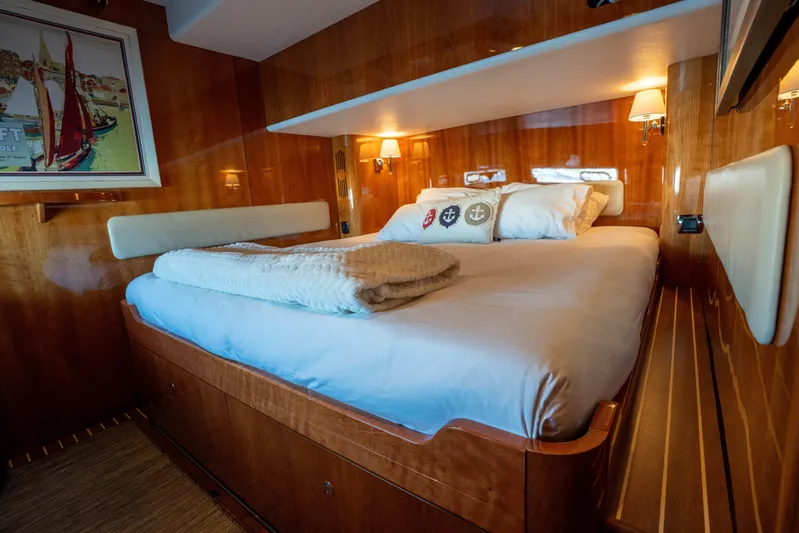 Tehiya Yacht Photos Pics Luxurious cabin interior of 2009 Privilege 615 yacht with cozy bedding and warm lighting.