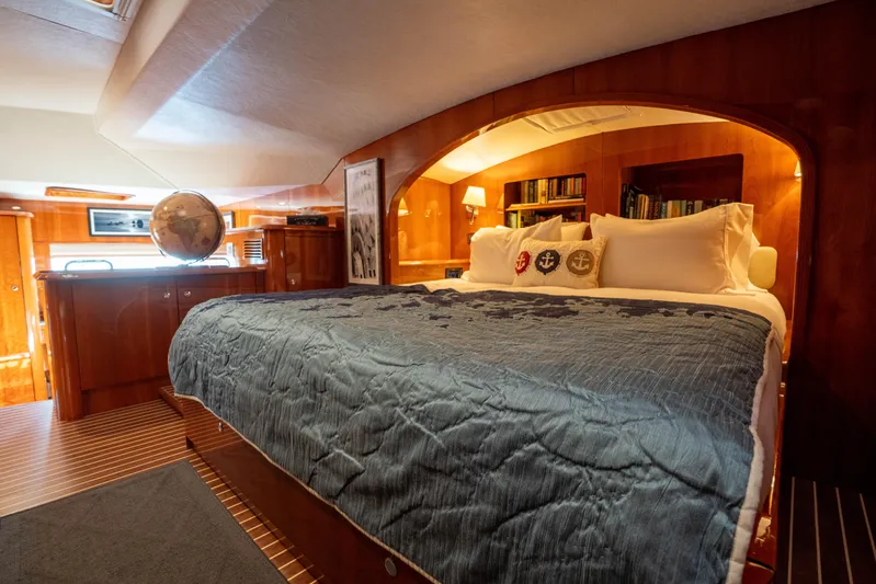 Tehiya Yacht Photos Pics Luxurious 2009 Privilege 615 yacht bedroom with cozy bedding and elegant wood finish.