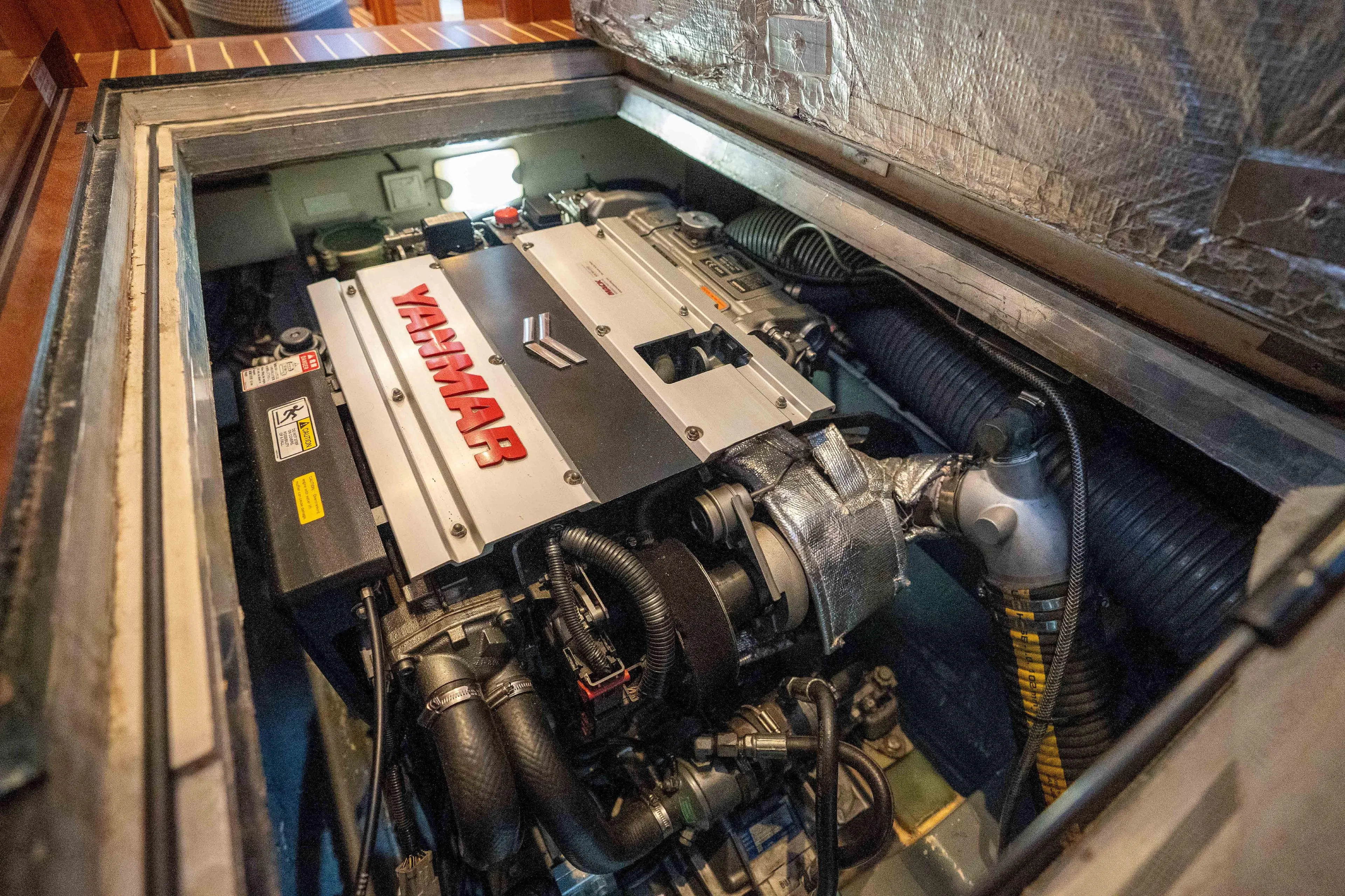 Tehiya Yacht Photos Pics Engine compartment of a 2009 Privilege 615 yacht featuring a Yanmar engine.