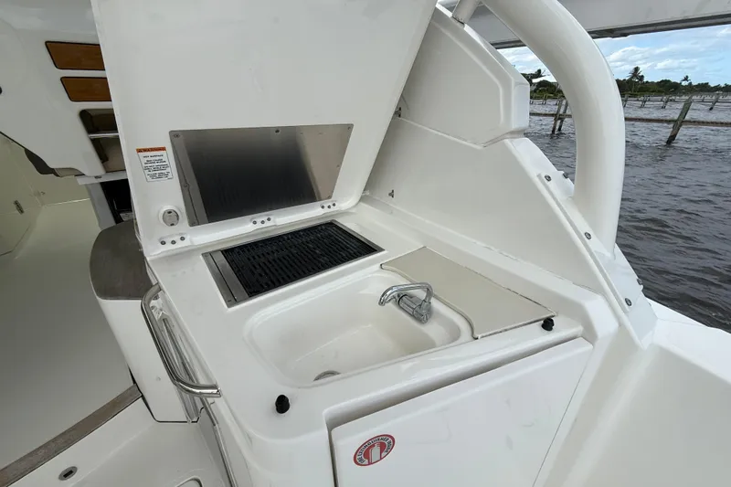  Yacht Photos Pics 2019 Pursuit DC 365 Dual Console boat with onboard sink and grill setup.