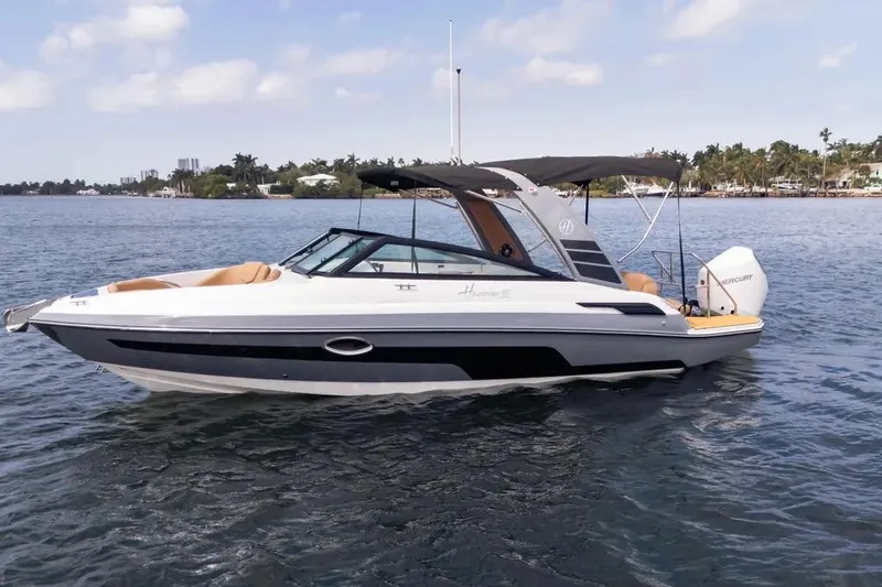  Yacht Photos Pics 2025 Hanover 255 boat on water, featuring sleek design and modern canopy.