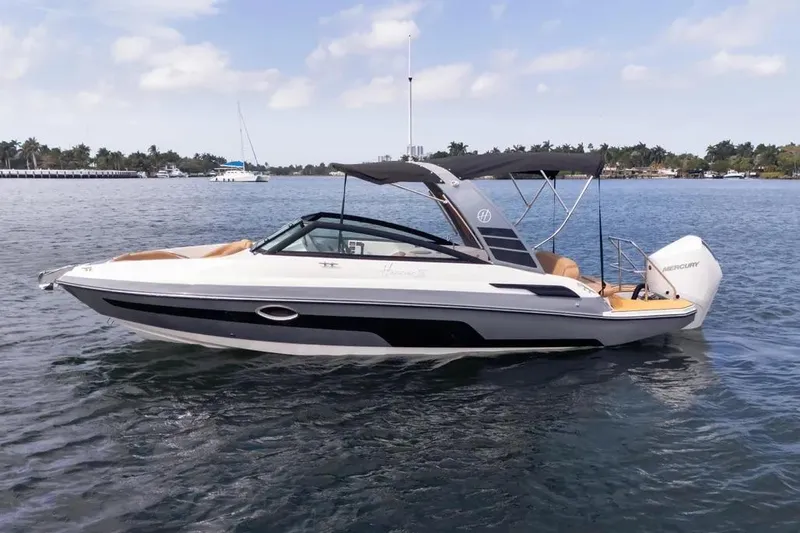  Yacht Photos Pics 2025 Hanover 255 boat on water, sleek design, black and white exterior, sunny day.